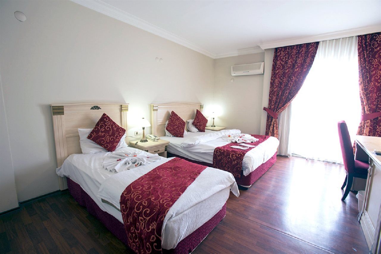 Duqqan Deluxe Hotel คูซาดาซี ภายนอก รูปภาพ