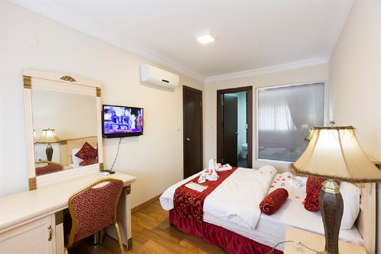 Duqqan Deluxe Hotel คูซาดาซี ภายนอก รูปภาพ